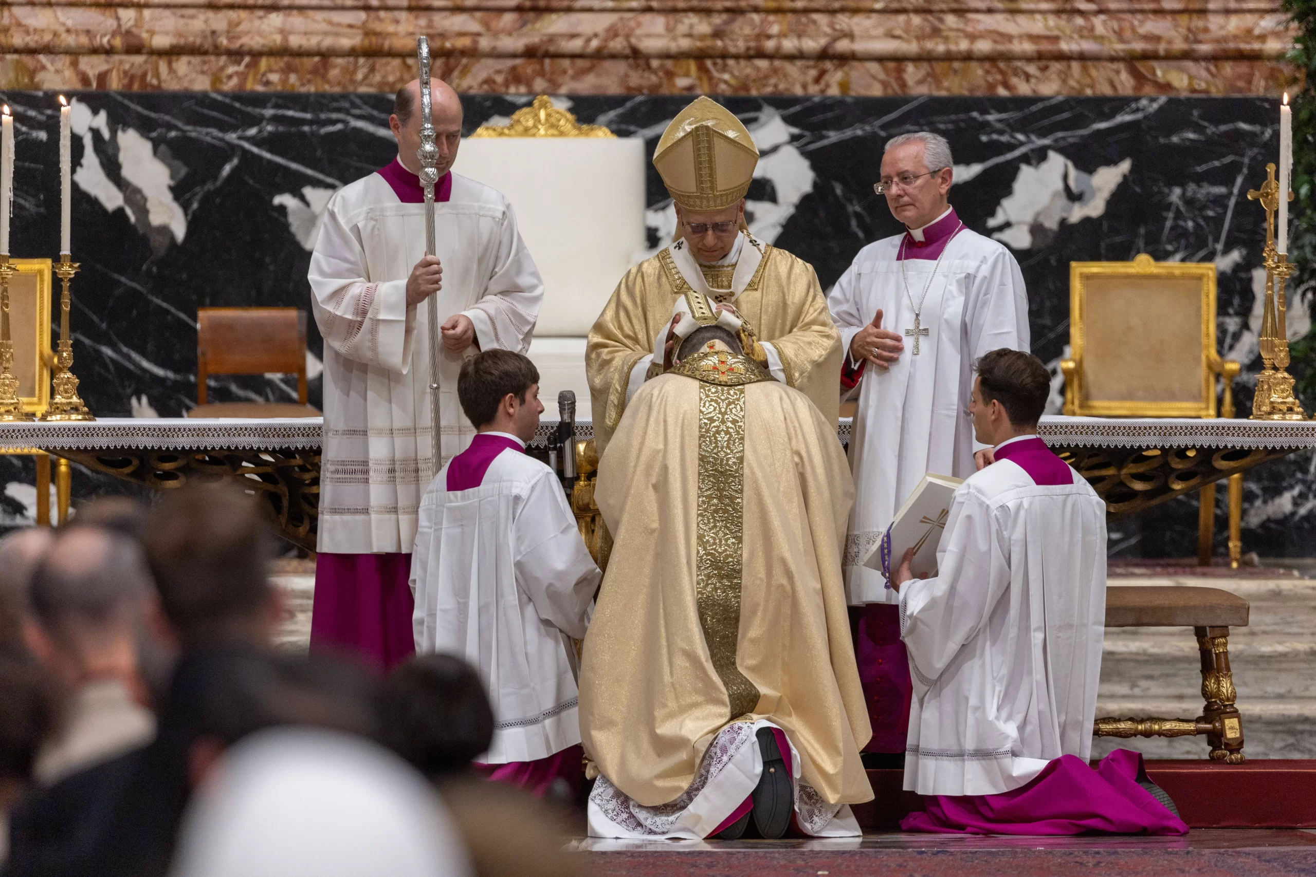 Pope Leo XIV places the bishop's miter on Archbishop Mirosław Stanisław Wachowski, the new apostolic nuncio to Iraq, as part of his episcopal ordination during a Mass in St. Peter's Basilica on Oct. 26, 2025. Credit: Daniel Ibanez/CNA.
