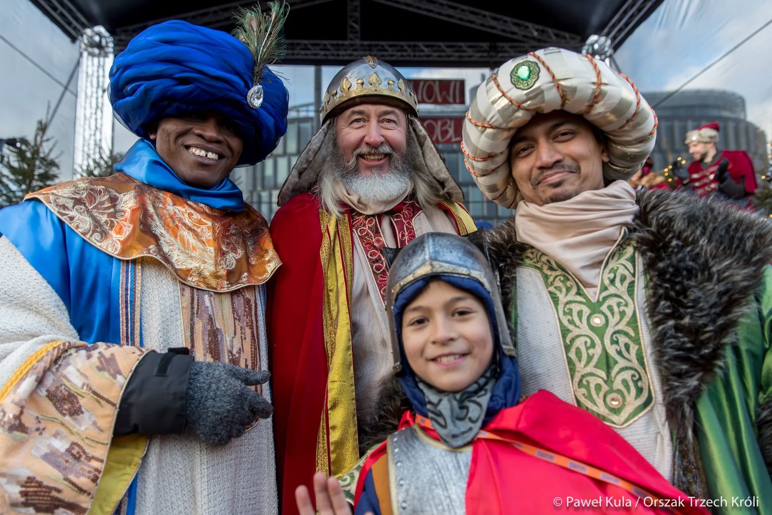 Participants portraying the Three Kings pose with a child during the Three Kings Procession in Warsaw, Poland, on Tuesday, Jan. 6, 2025. Credit: Paweł Kula/Fundacja Orszak Trzech Króli