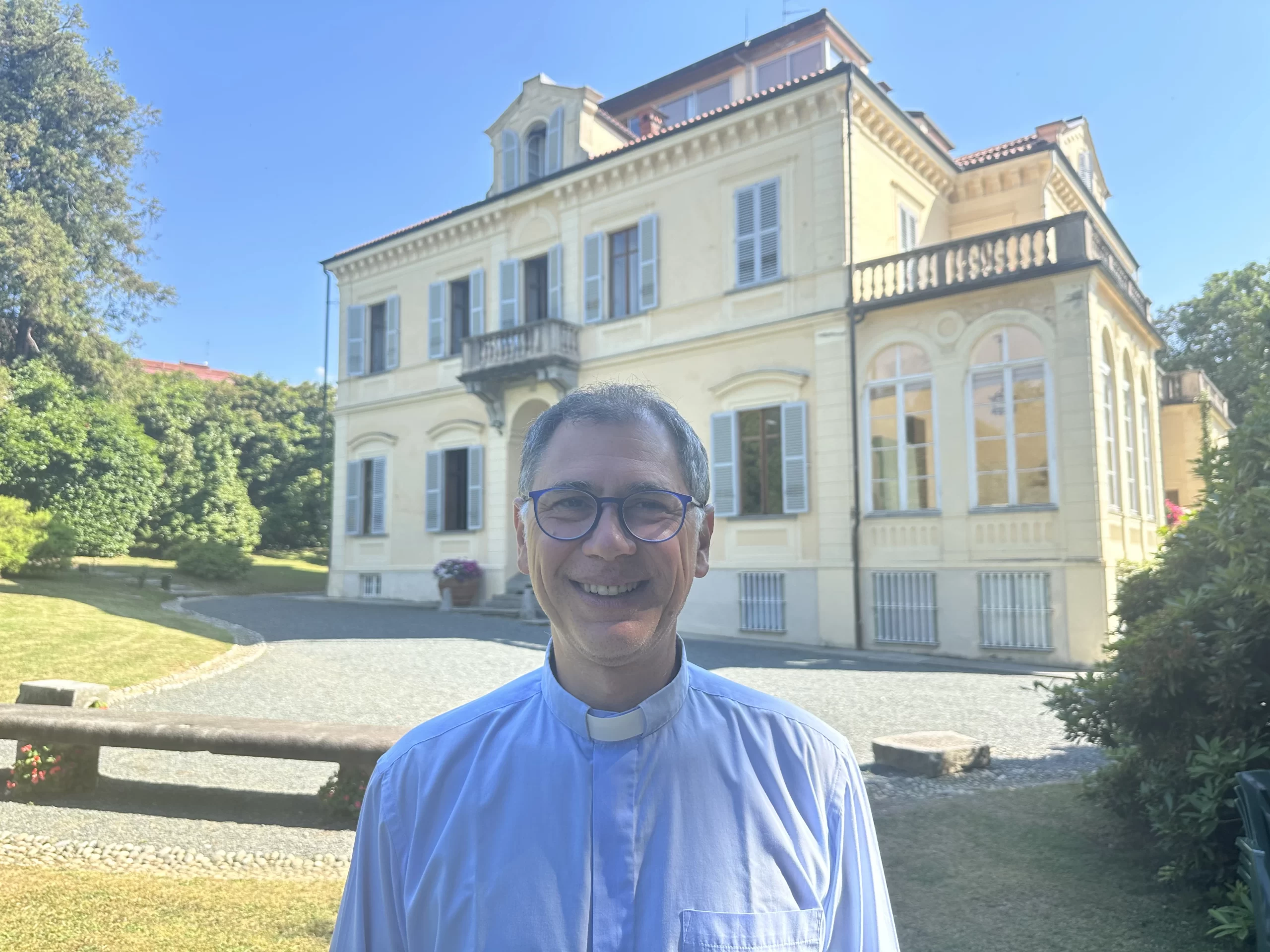 Father Luca Bertarelli, a parish priest in Pollone, Italy, stands in front of the Frassati family home, Villa Ametis, where Pier Giorgio Frassati spent his summers climbing in the nearby mountains, Thursday, July 3, 2025. Credit: Courtney Mares/CNA