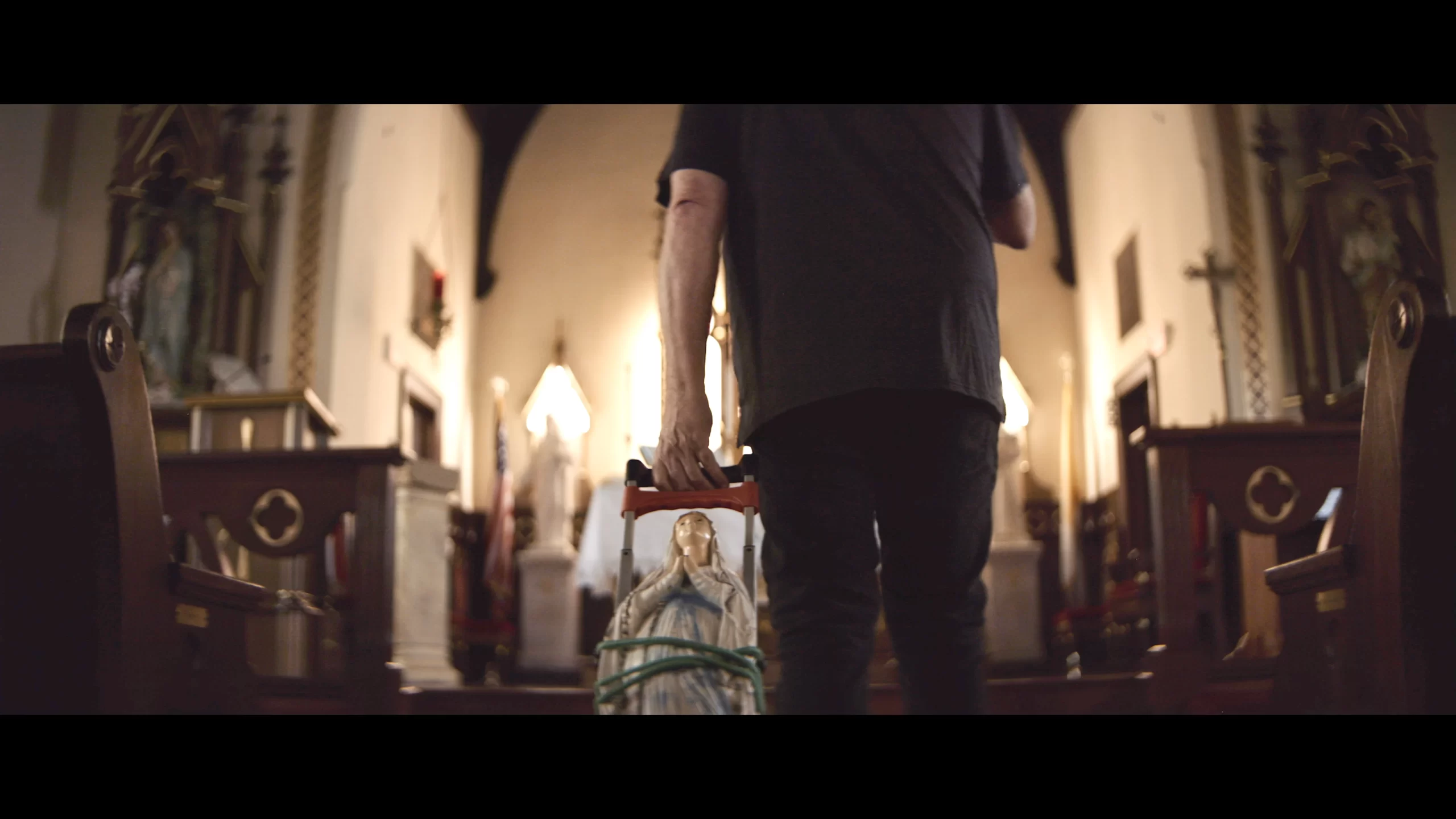 Kevin Matthews, former radio personality, wheels "Broken Mary" into a Catholic parish. Credit: ODB Films