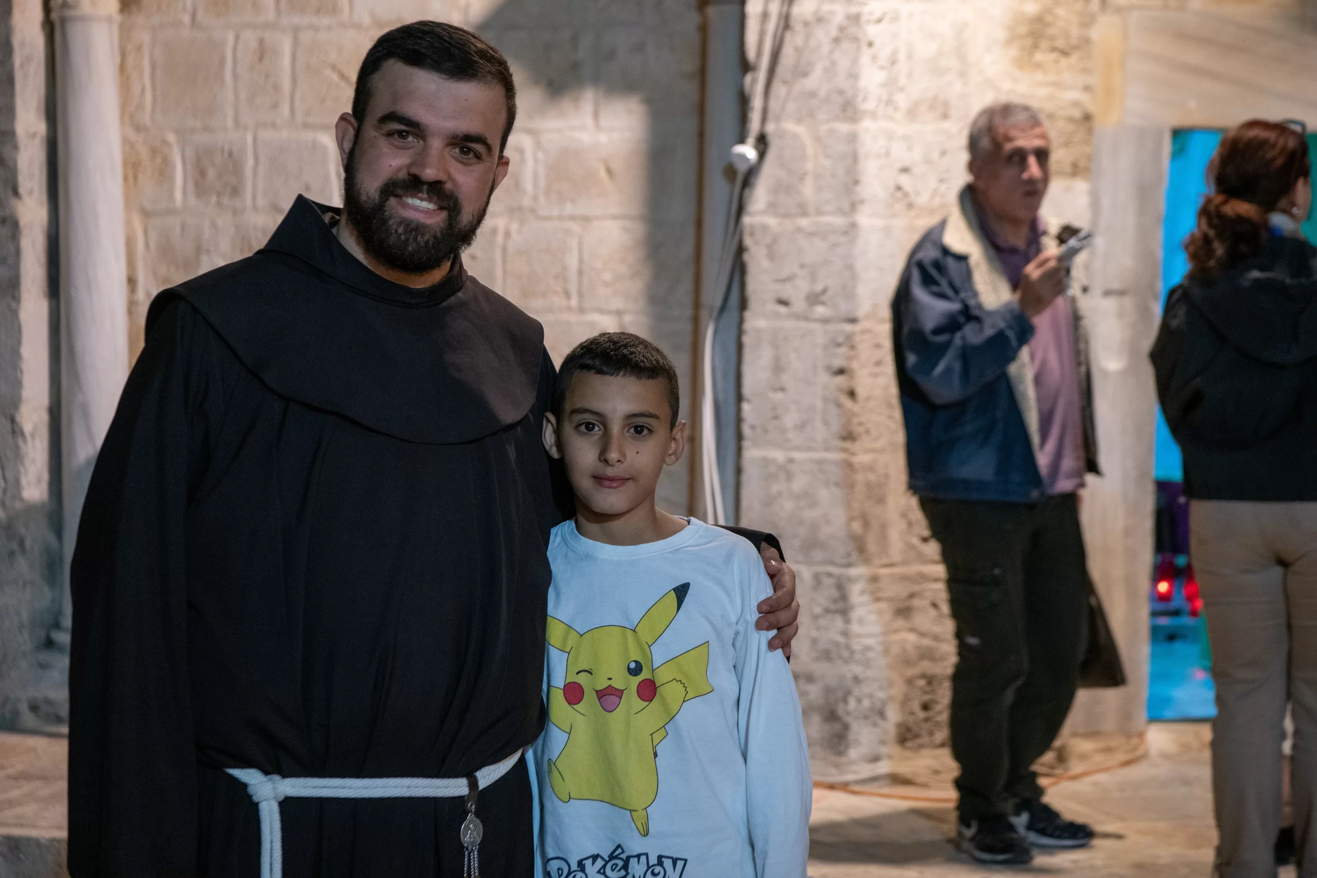 Brother Noor Amash, a Franciscan friar of the Custody of the Holy Land, together with George Sammour, one of the altar boys serving in the Latin parish of Jerusalem. “I wanted to come here to learn more about the Ascension of Jesus. I want to know more about Jesus and His life,” Sammour told CNA. Credit: Marinella Bandini