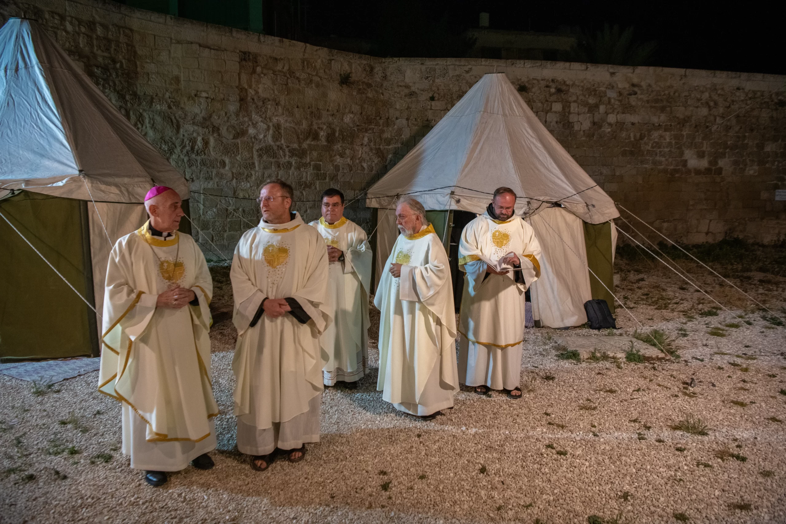 Some priests wait for their turn to celebrate the Ascension Mass in the Chapel of the Ascension on the Mount of Olives in Jerusalem during the night of May 8-9, 2024. Credit: Marinella Bandini