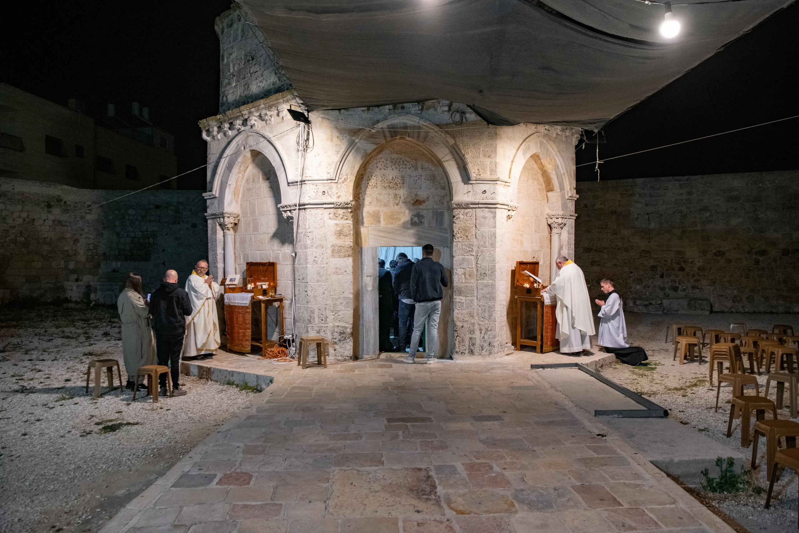 Three Masses were taking place simultaneously in the area of the Chapel of the Ascension on the Mount of Olives in Jerusalem during the night of May 8-9, 2024, for the solemnity. Besides inside the chapel, it's also possible to celebrate at two portable altars placed outside. Credit: Marinella Bandini