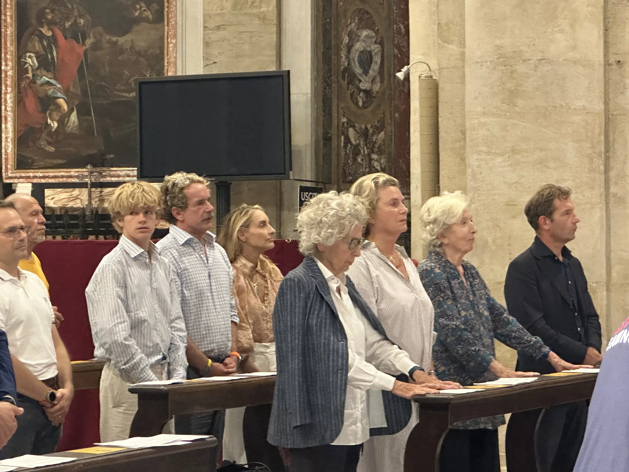 Members of Pier Giorgio Frassati's family, including his 93-year-old niece Giovanna Gilardini, stand at a Mass honoring the centenary of Frassati’s death in Turin, Italy, Friday, July 4, 2025. Credit: Courtney Mares/CNA