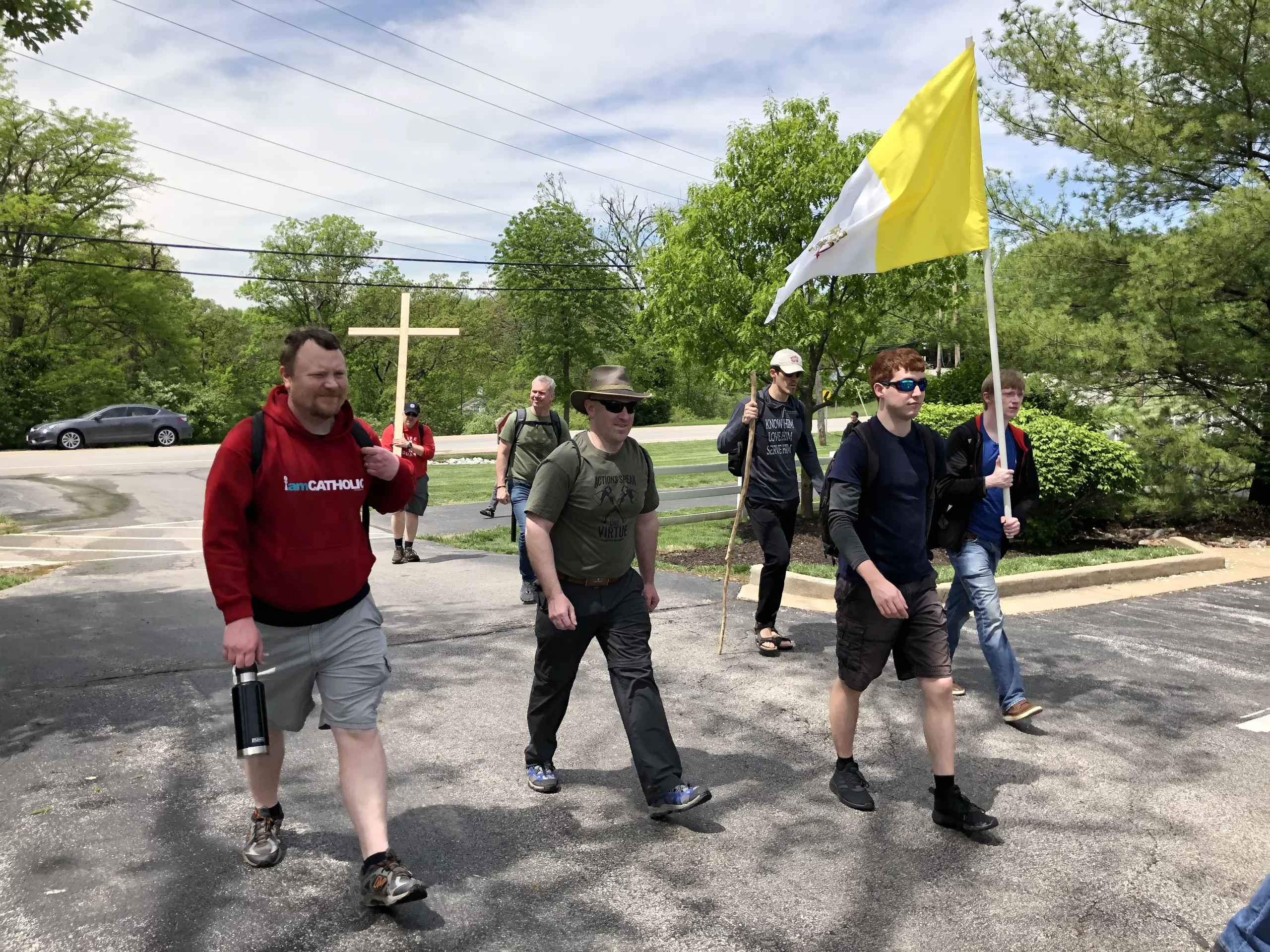 Men walk through St. Louis during the Joseph Challenge Pilgrimage in 2019 carrying a wooden cross and a Vatican flag. Credit: Jonah McKeown/CNA