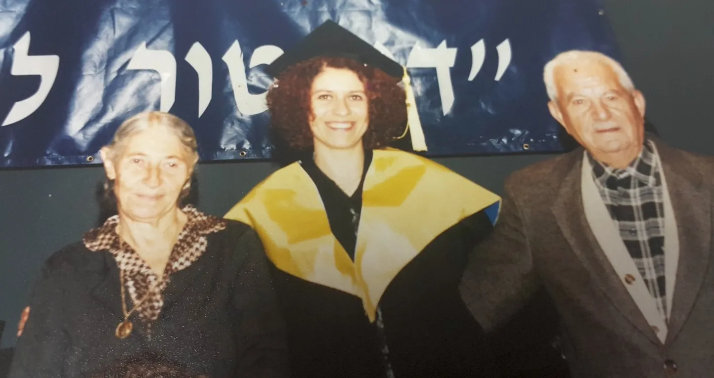 Professor Mouna Maroun with her parents on her graduation day in 2000. “I think the lack of expectations from me to succeed was the secret of my success," she told CNA. "I could do what I believed in, I had a dream and I followed this dream without pressure — only my family encouraged me to continue in this pathway.” Credit: Photo courtesy of Professor Mouna Maroun