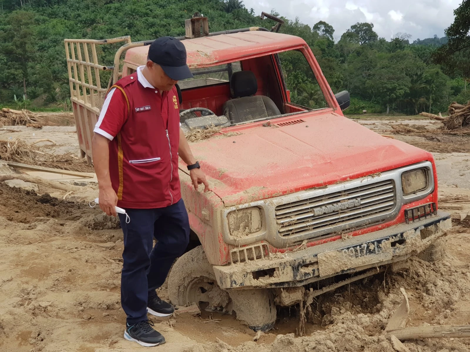 The executive director of Caritas Indonesia, Father Fredy Rante Taruk, visits a disaster site following flash floods and landslides in Indonesia on Dec. 23, 2025. Credit: Caritas Indonesia