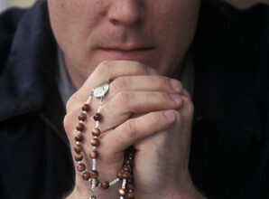 Priest Praying Rosary