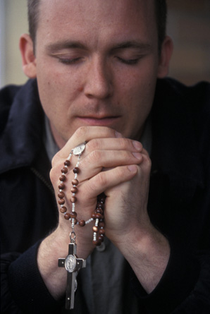 Priest Praying Rosary