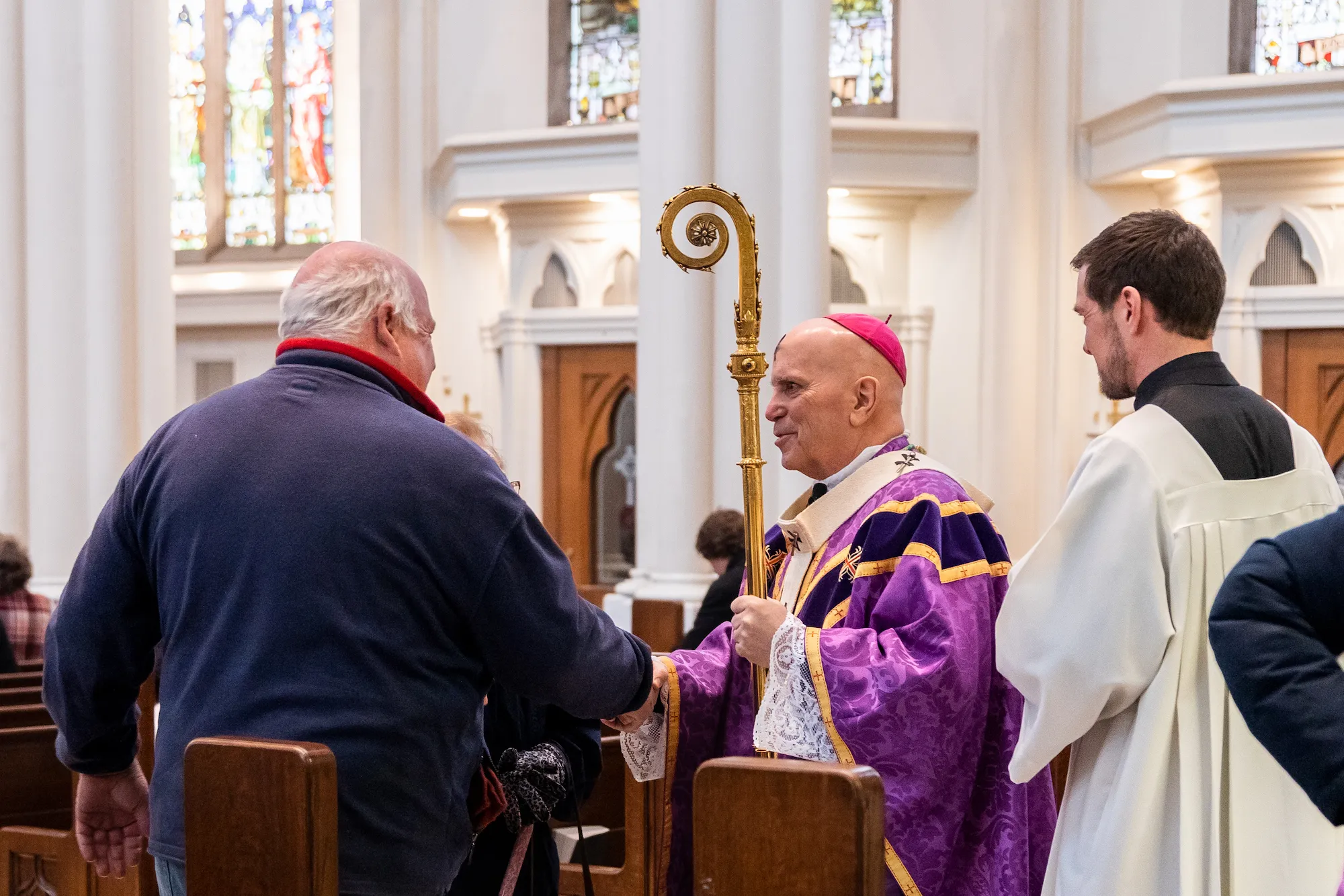 Archbishop Samuel Aquila of Denver greets the faithful after Mass at the Cathedral Basilica of the Immaculate Conception on Ash Wednesday, Feb. 22, 2023. Credit: Allison Holdridge/Archdiocese of Denver