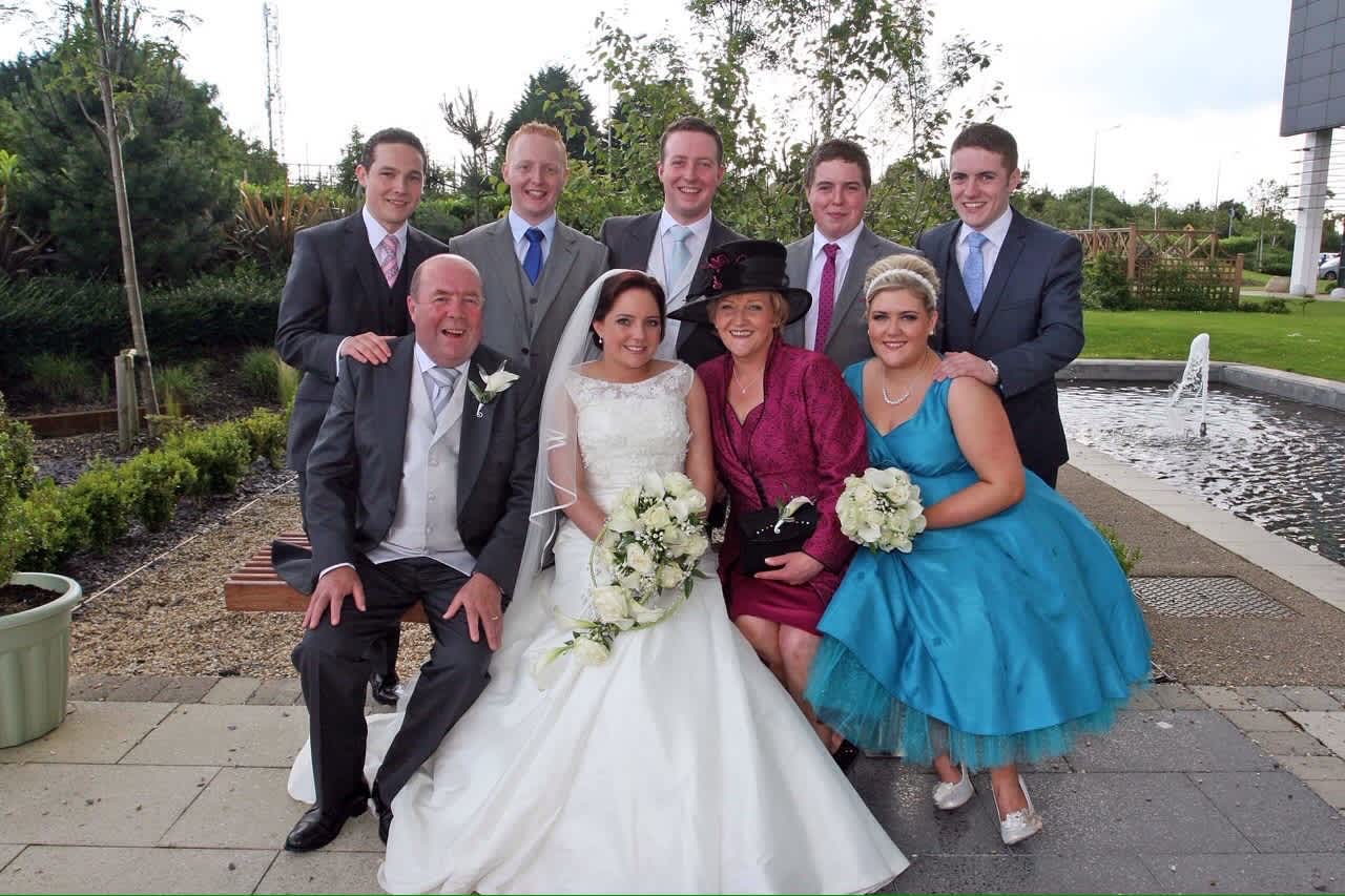 The Bell Family pictured at a family wedding before the death of Kevin Bell, pictured second from the back row on the left. Kevin was killed in New York in 2013, after which his parents in Ireland founded the Kevin Bell Repatriation Trust to help bring loved ones home to Ireland who have lost their lives abroad. | Credit: Photo courtesy of the Kevin Bell Repatriation Trust