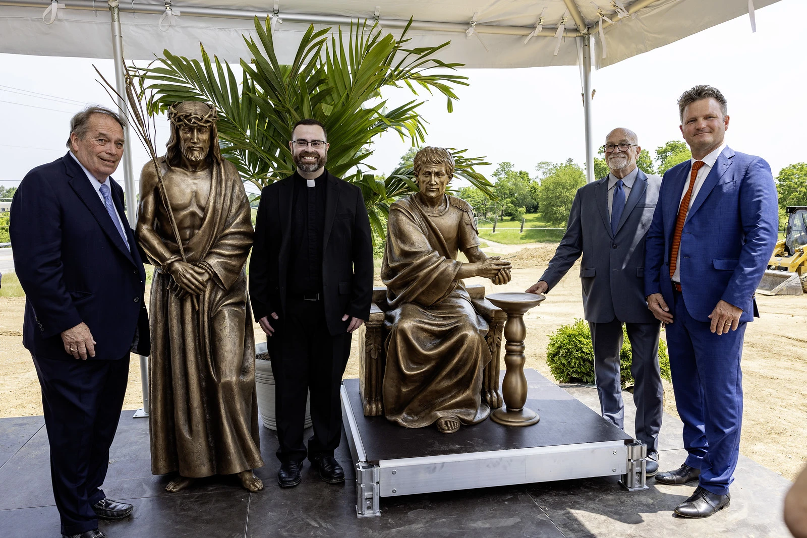 Jerry Lundergan (left) and others pose with statutes of Christ and Pontius Pilate in Maysville, Kentucky, Tuesday, June 3, 2025. Credit: Tammie Brown Photography