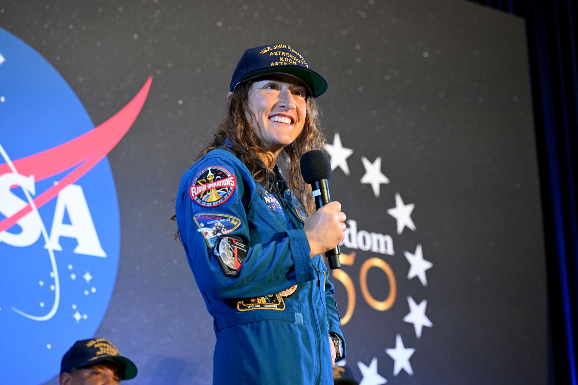 NASA’s Artemis II mission specialist Christina Koch shares brief remarks with friends, family, and colleagues after she landed at Ellington Airport near NASA’s Johnson Space Center in Houston on Saturday, April 11, 2026, after a nearly 10-day journey around the moon and back to Earth. | Credit: Helen Arase Vargas/NASA-JSC