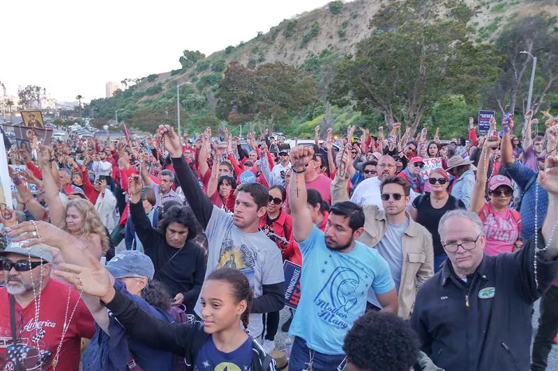 Thousands raise their arms in prayer to protest the Dodgers' event honoring the Sisters of Perpetual Indulgence on June 16, 2023. Photo courtesy of CatholicVote