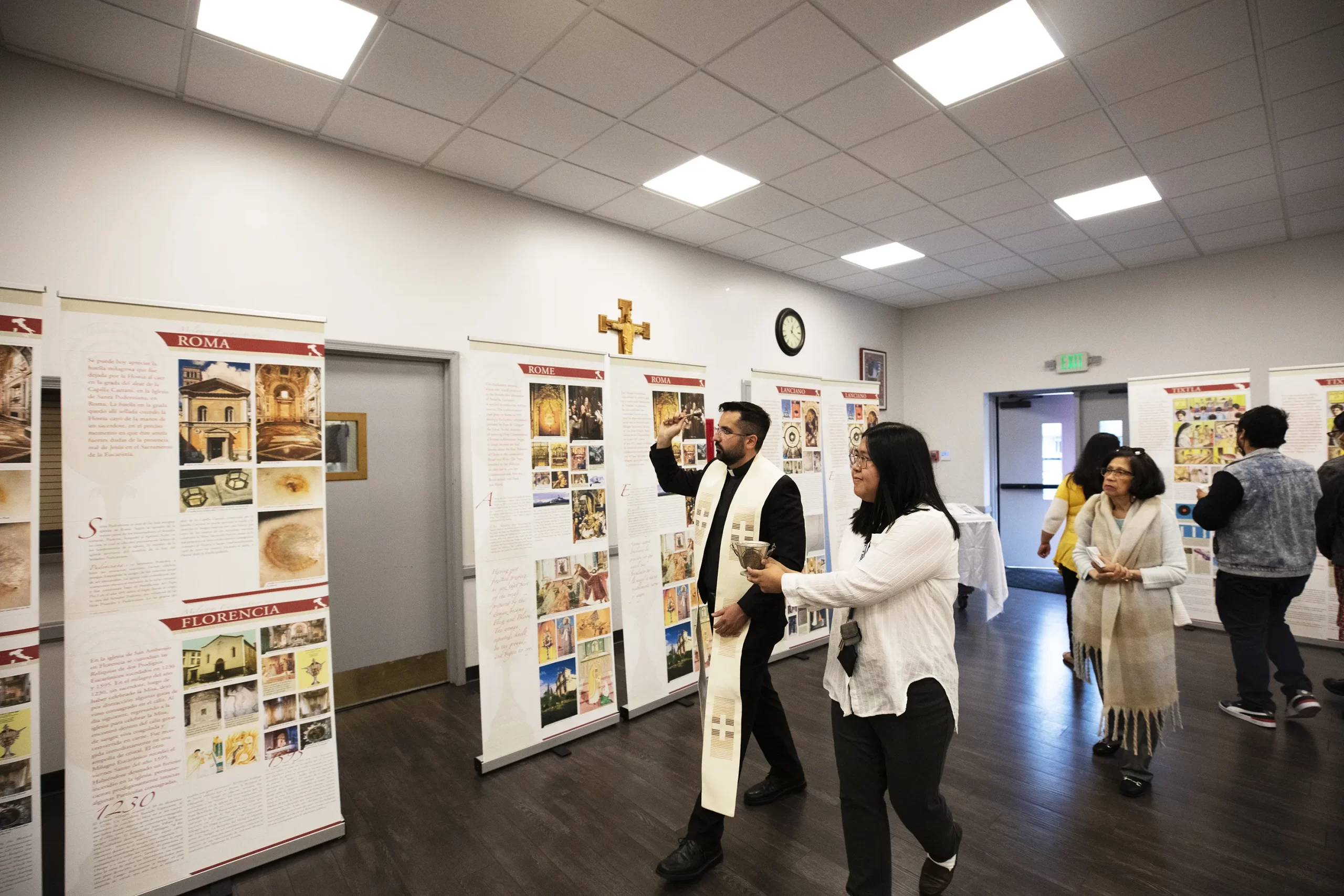 Father Juan Ochoa, pastor of Christ the King Church, blesses the parish’s Carlo Acutis Eucharistic miracles exhibit June 11. Victor Alemán/Angeles News