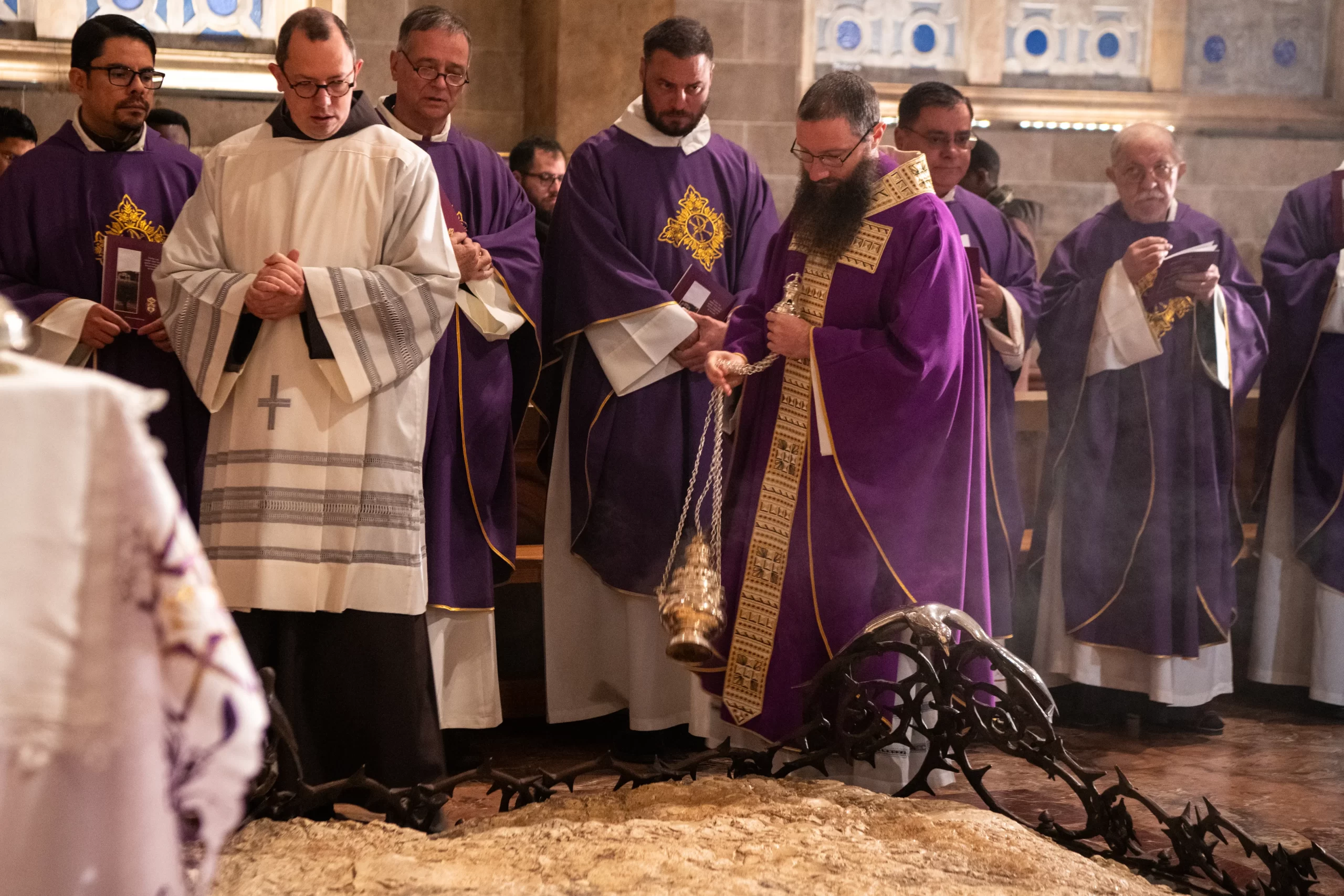 Father Alessandro Coniglio, who presided over the Holy Wednesday Mass at the Basilica of the Agony (Gethsemane), incenses the stone of agony at the beginning of the Eucharistic celebration.  This is the very place where Jesus withdrew to pray after the Last Supper, in an orchard known as Gethsemane at the foot of the Mount of Olives. March 27, 2024. Credit: Courtesy of the Custody of the Holy Land