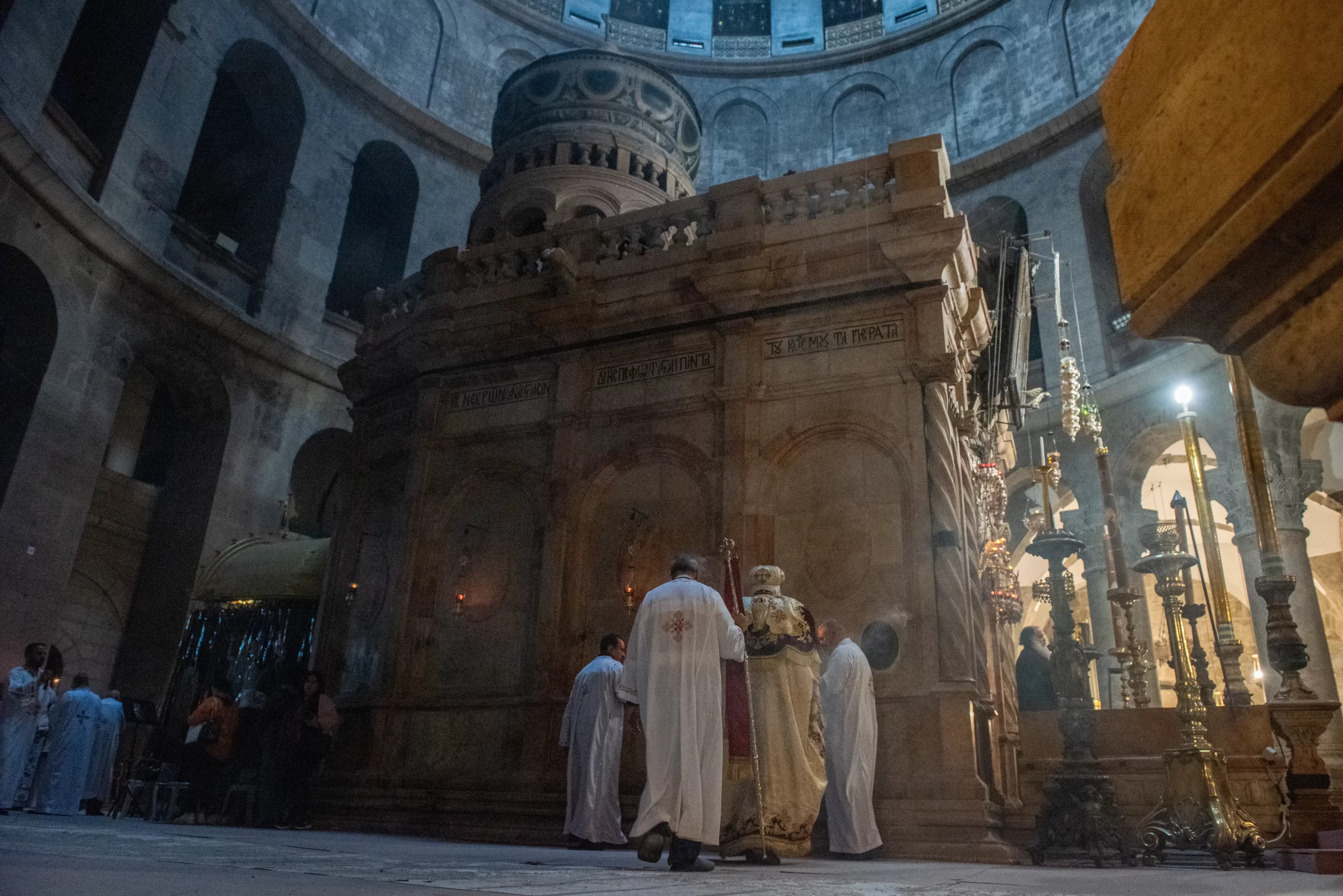 His Eminence Anba Antonios (right), Coptic Orthodox archbishop of Jerusalem, incenses the edicule of the Holy Sepulcher (containing Christ's tomb) during the Sunday Mass on March 17, 2024. Credit: Marinella Bandini