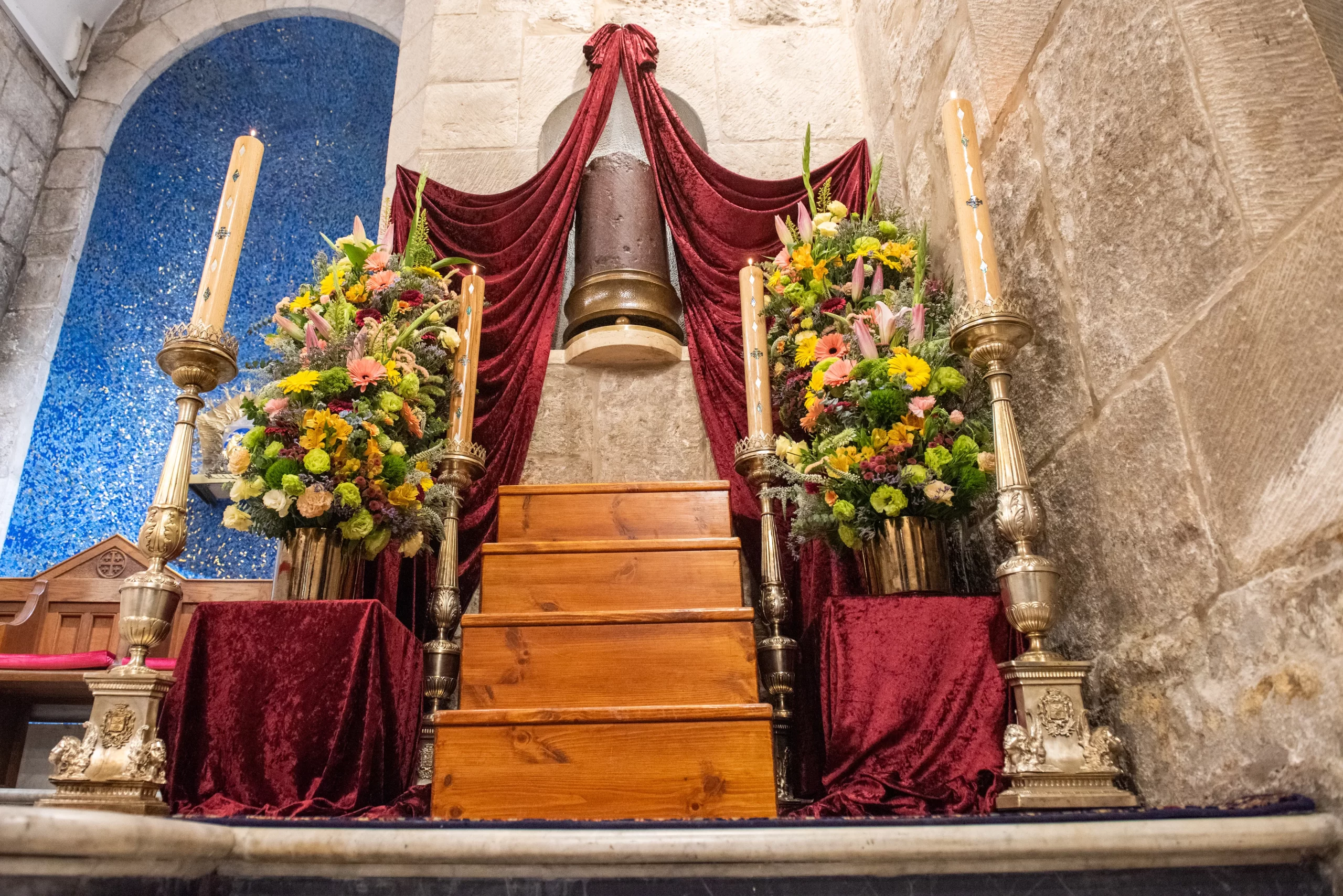 The column of the Flagellation, made of red porphyry, is kept in a niche within the Chapel of the Apparition inside the Basilica of the Holy Sepulcher, where it has been preserved since the 14th century. On Holy Wednesday, a day especially dedicated to its veneration, the friars of the Custody of the Holy Land prepare a special adornment with drapes and flowers for the column. March 27, 2024. Credit: Marinella Bandini