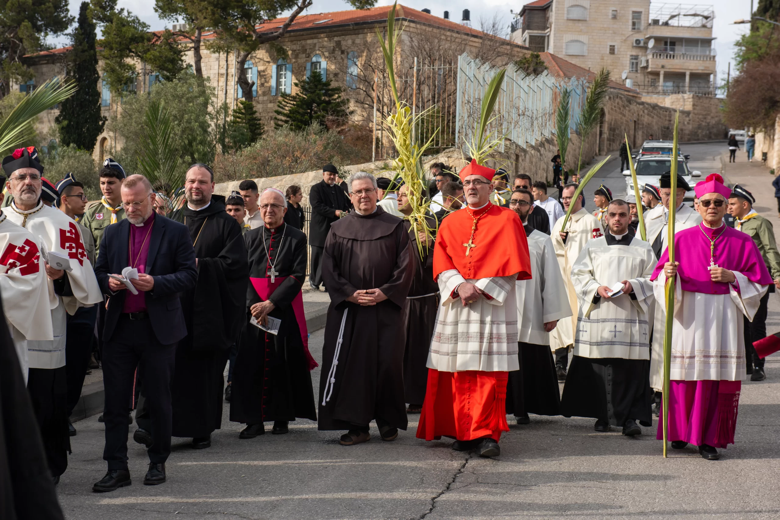 Cardinal Pierbattista Pizzaballa, the Latin patriarch of Jerusalem, and Father Francesco Patton, custos of the Holy Land (on Pizzaballa's right), walk together in the Palm Sunday procession from Bethphage to Jerusalem on March 24, 2024. As per tradition, the religious authorities close the procession. Credit: Marinella Bandini