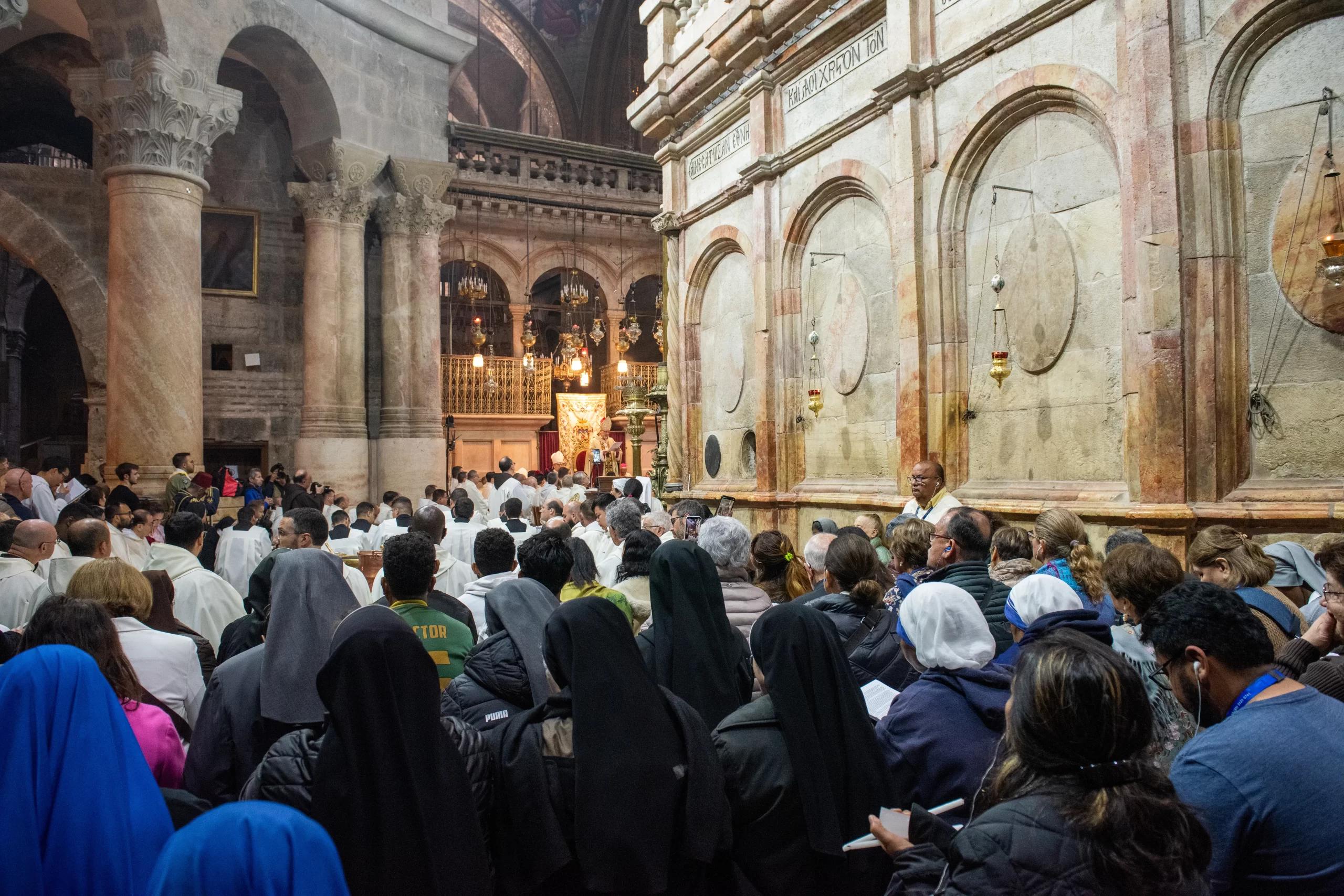 A view of the Basilica of the Holy Sepulcher during the Easter Vigil, which was celebrated on the morning of Saturday, March 30, 2024. On the right, the north wall of the edicule, which houses the tomb of Jesus. In the background is the seat from which Cardinal Pierbattista Pizzaballa, the Latin Patriarch of Jerusalem, celebrated the Mass. The basilica was notably empty, with a clear absence of pilgrims and Christians who usually come from the Palestinian Territories for the Easter festivities. Credit: Marinella Bandini