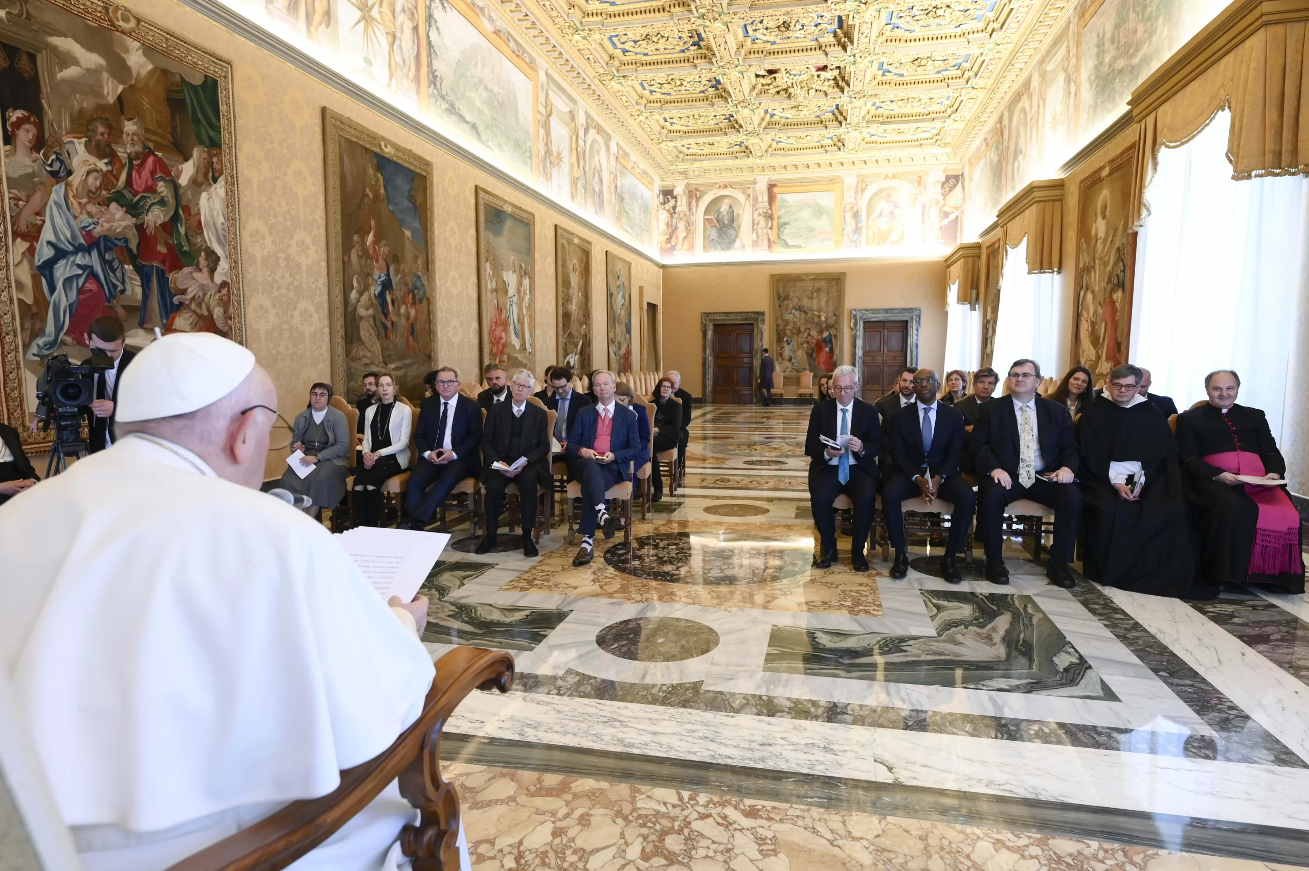 Pope Francis meets with participants of the Minerva Dialogues — a meeting of scientists, engineers, business leaders, lawyers, philosophers, Catholic theologians, ethicists, and members of the Roman Curia to discuss digital technologies — at the Vatican on March 27, 2023. Credit: Vatican Media