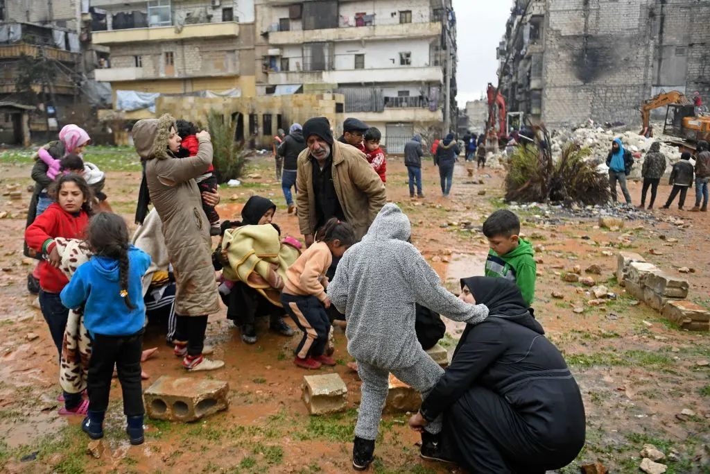 People evacuate their homes following a deadly earthquake that shook Syria at dawn on Feb. 6, 2023, in Aleppo’s Salaheddine district. At least 810 people were killed in Syria as buildings collapsed after a 7.8-magnitude earthquake struck neighboring Turkey, state media and rescuers said. Photo by AFP via Getty Images