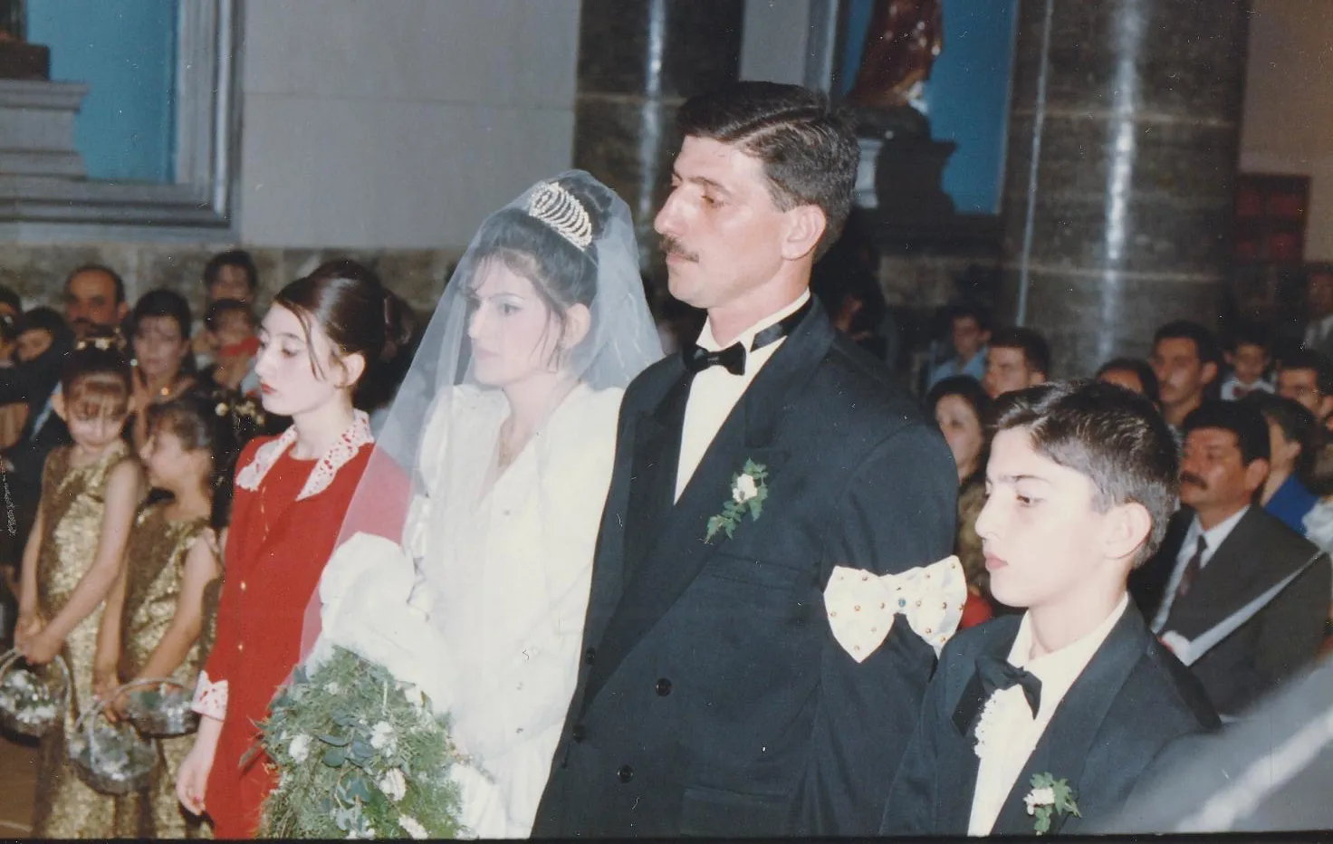 Georgena Habbaba on her wedding day in Our Lady of Perpetual Help Chaldean Catholic Church in Mosul, Iraq, on Oct. 14, 1998. Habbaba, who now lives in the United States, said her eyes filled with tears when she recently saw photos of her home parish and school rebuilt and consecrated. Credit: Photo courtesy of Georgena Habbaba