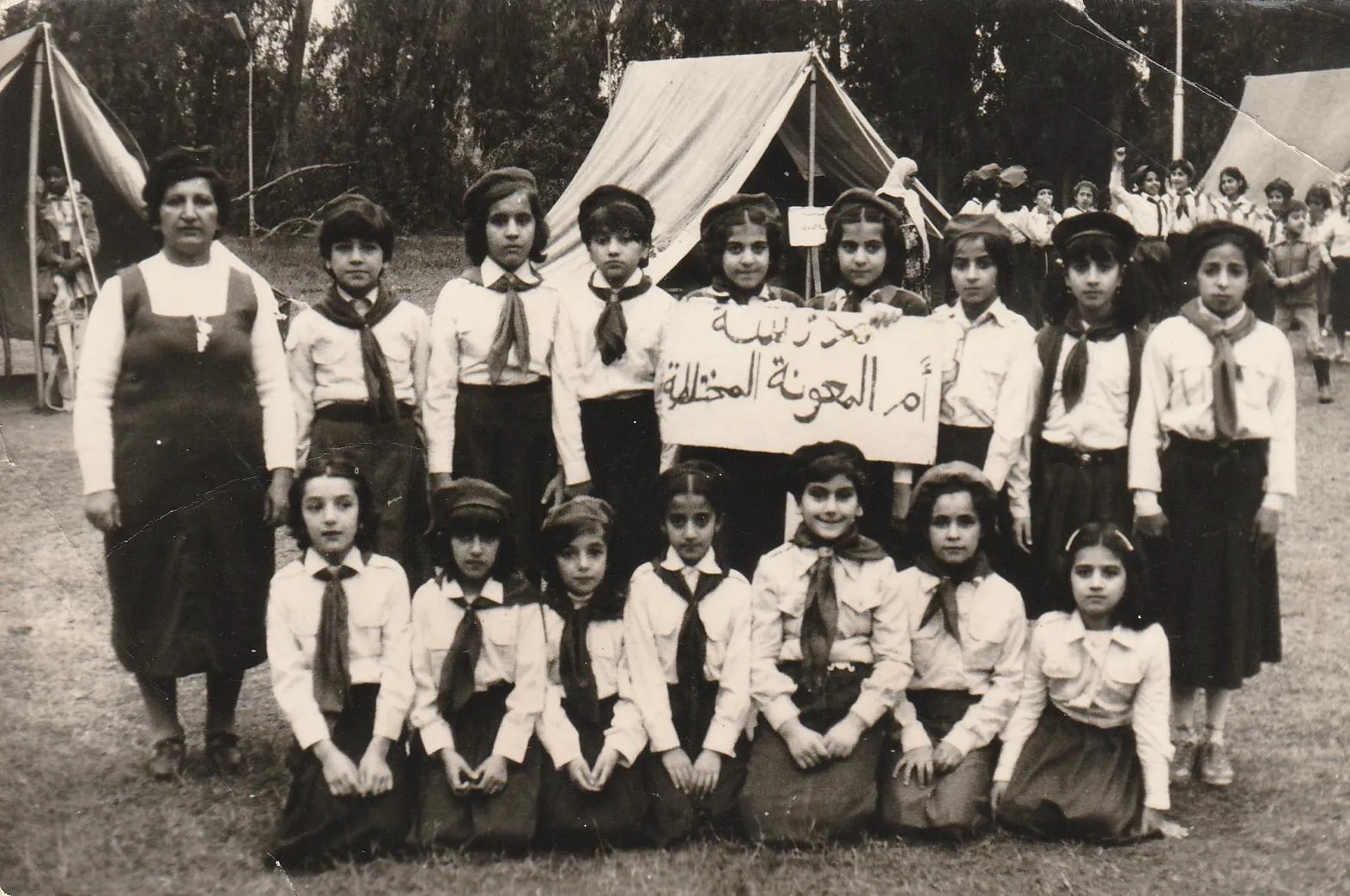 Georgena Habbaba pictured circa 1985 in the front kneeling, third from the right with her school scout team at Our Lady of Perpetual Help Chaldean Catholic School in Mosul, Iraq. Habbaba, who now lives in the United States, said her memories of her childhood days at the school and parish are "wonderful." Credit: Photo courtesy of Georgena Habbaba