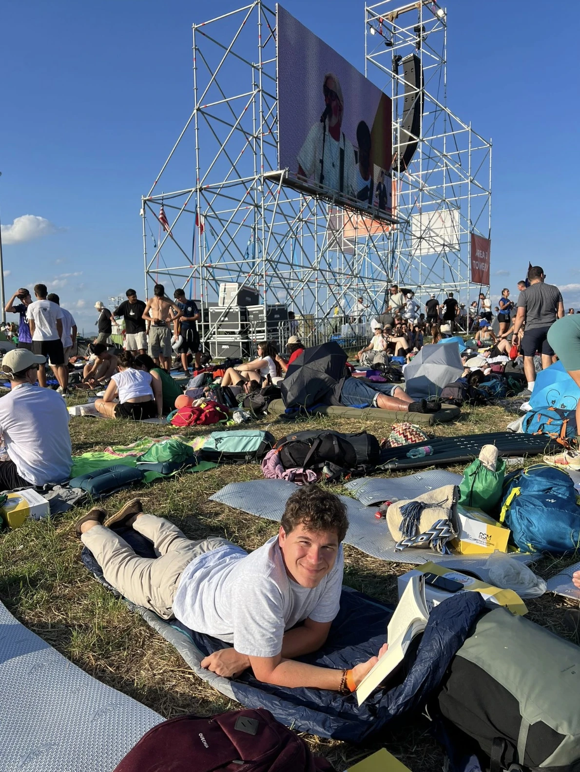 A young man reads a book on the Tor Vergata esplanade. Credit: Photo courtesy of Claudia Arrieta