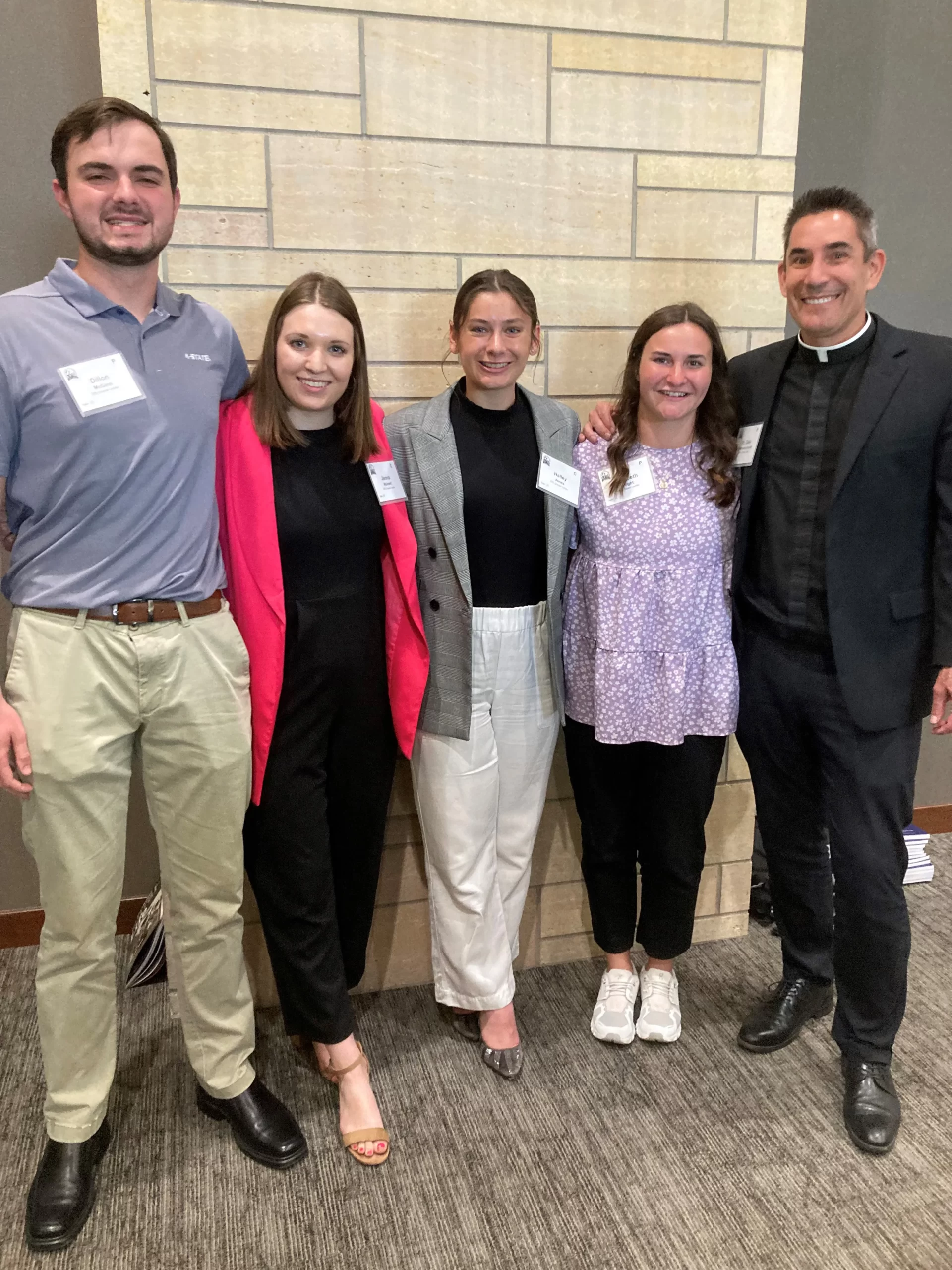 Kansas State University students, from left: junior Dillon McGinn, 20; junior Jenna Reinert, 21; senior Halley Jones, 21; Elizabeth Wright, 22, (a 2023 graduate who started a Catholic Rural Life chapter in 2021); and Father Gale Hammerschmidt, pastor and chaplain at St. Isidore’s on campus. Credit: Susan Klemond/CNA