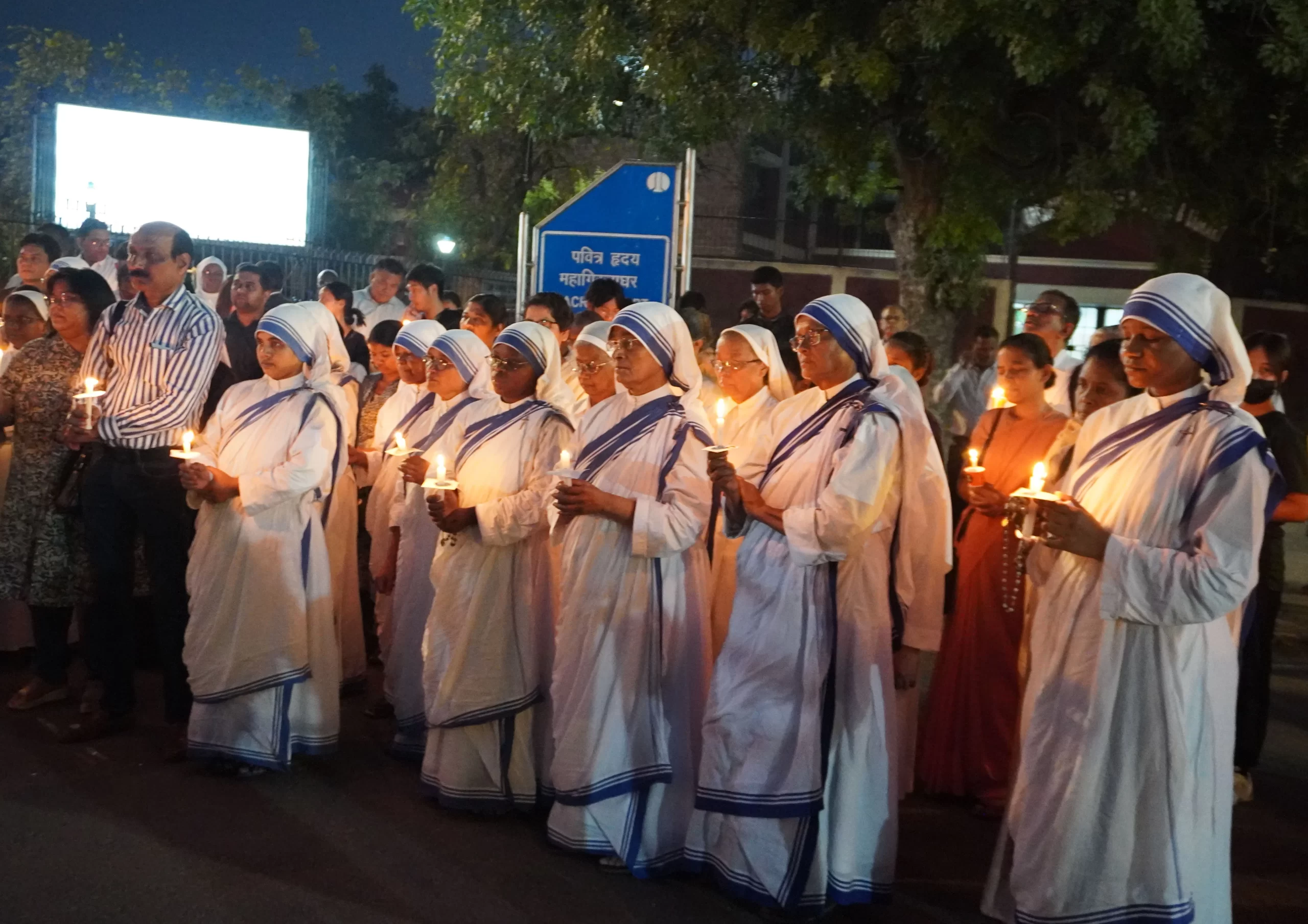Nuns from the Missionaries of Charity hold candles in recognition of the May 3, 2023, annivesary of ethnic violence in Manipur, India. Credit: Anto Akkara