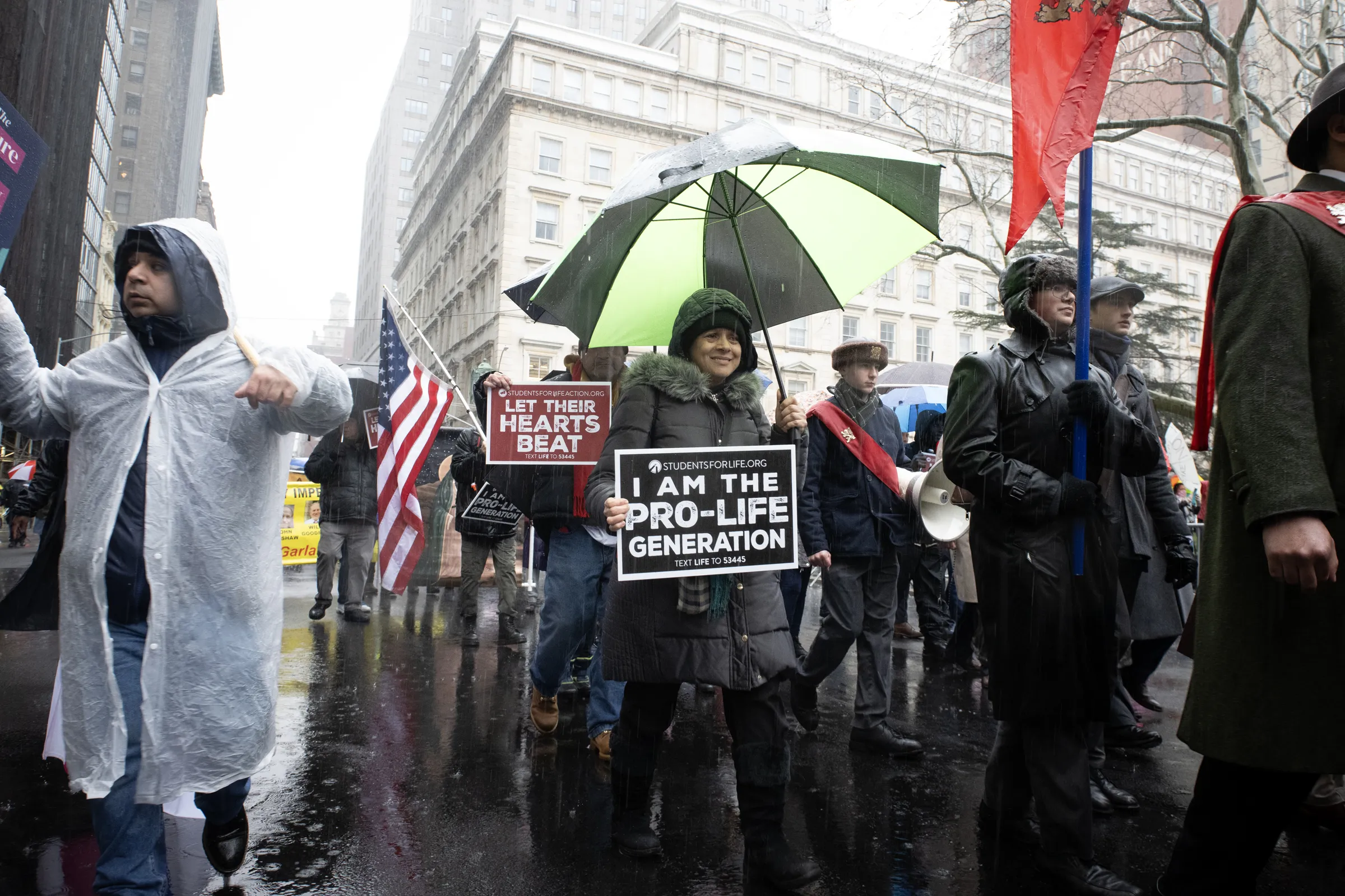 Hundreds of pro-lifers joined the International Gift of Life Walk in lower Manhattan, New York City, despite heavy rain and protestors on March 23, 2024. Credit: Jeffrey Bruno