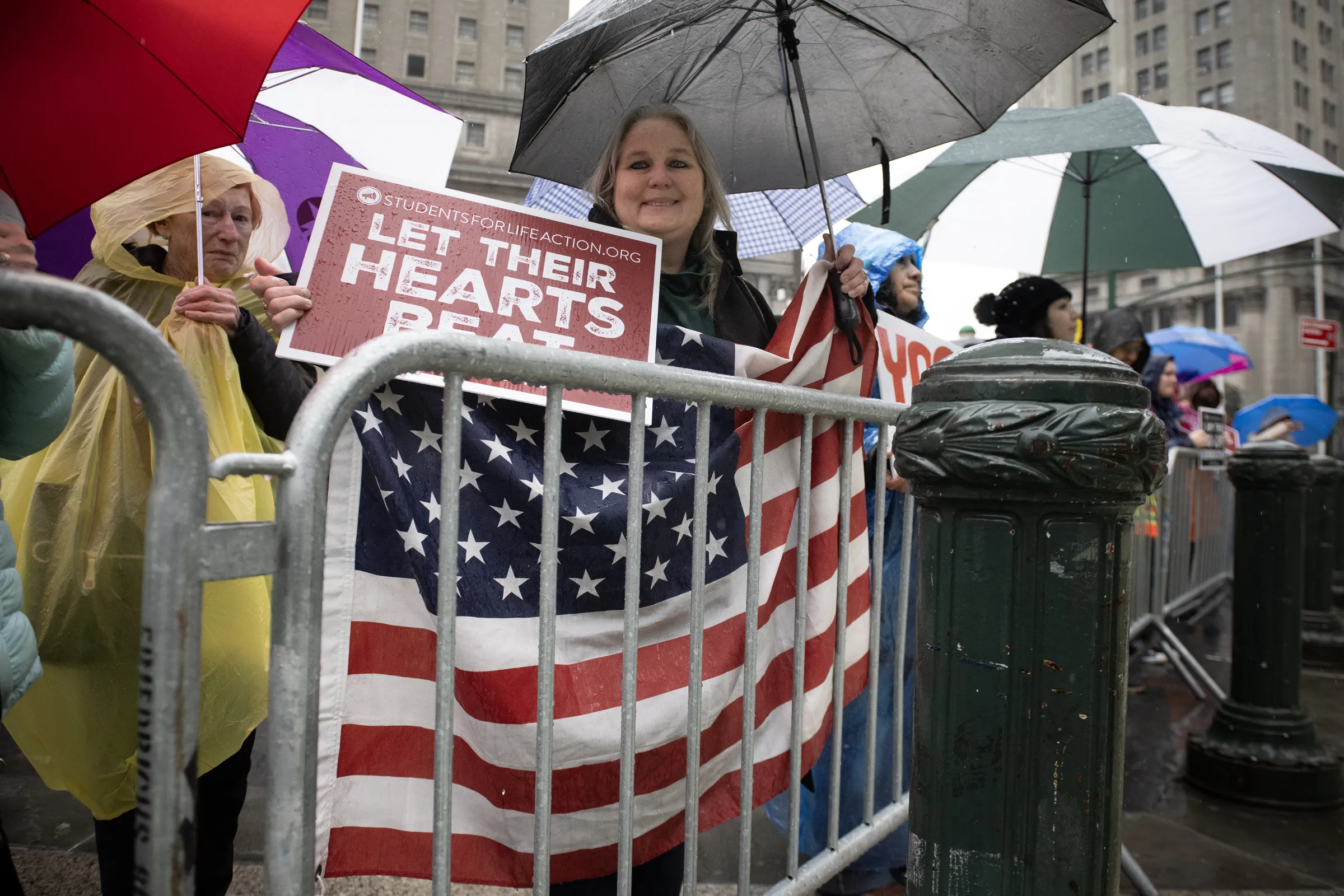 Hundreds of pro-lifers joined the International Gift of Life Walk in lower Manhattan, New York City, despite heavy rain and protestors on March 23, 2024. Credit: Jeffrey Bruno