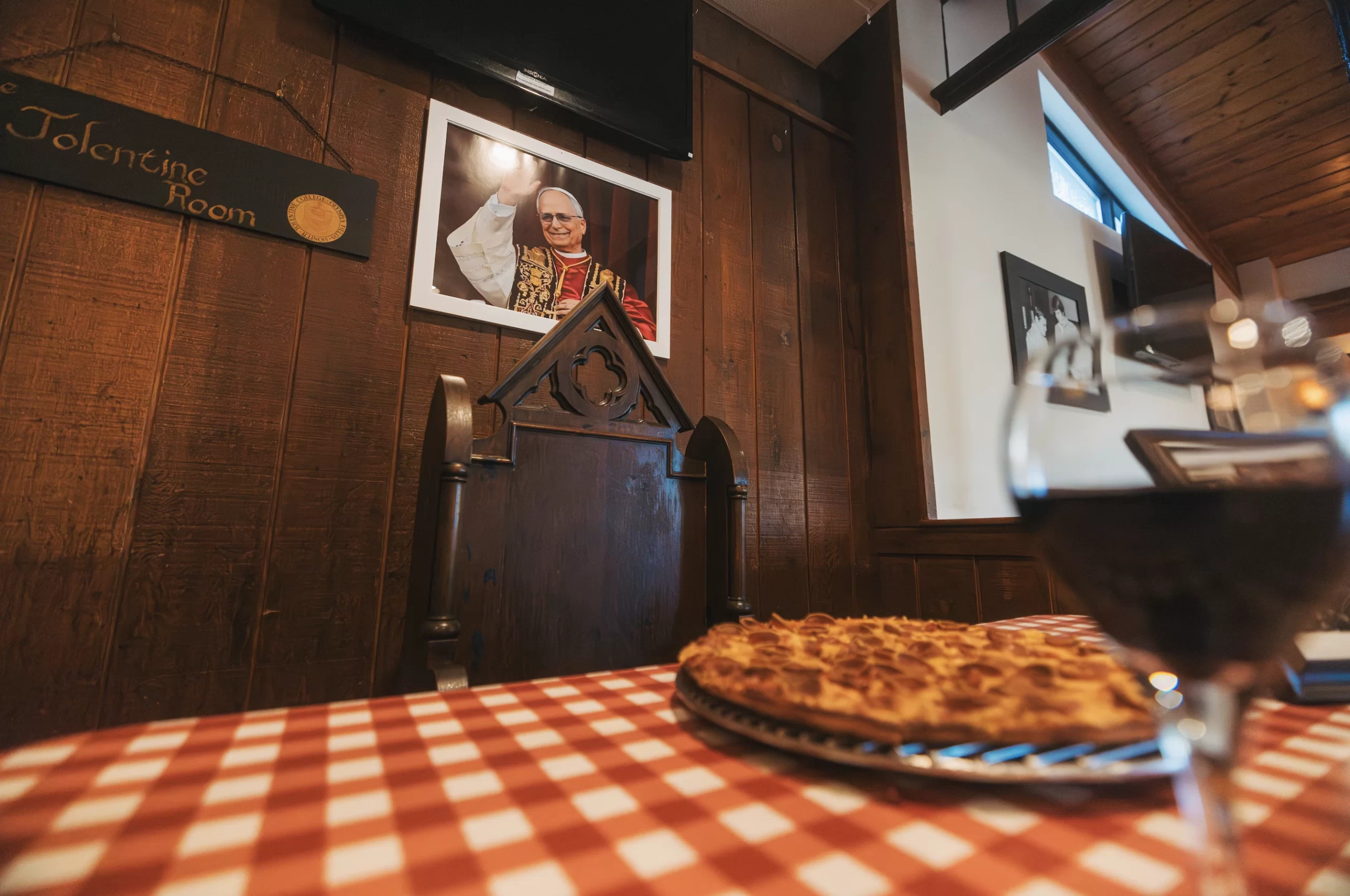 A photo of Pope Leo XIV hangs in Aurelio's Pizzeria. Credit: Spirit Juice Studios