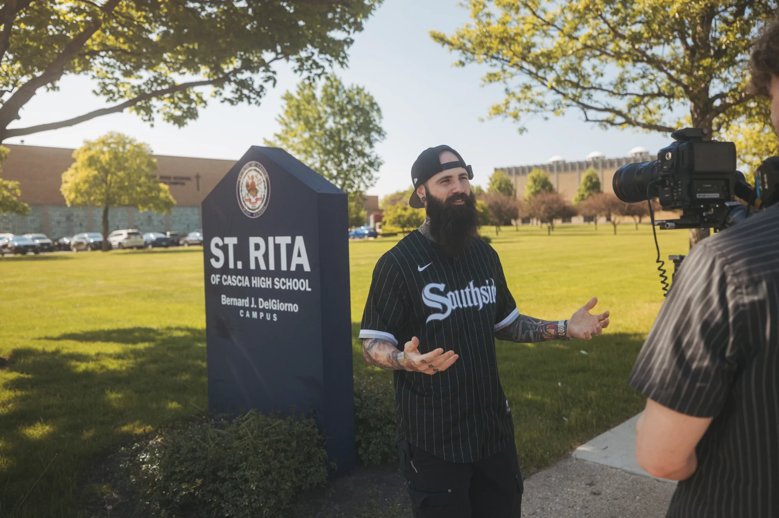 CEO and President of Spirit Juice Studios Rob Kaczmark films outside of St. Rita of Cascia High School, the high school were Pope Leo XIV taught math. Credit: Spirit Juice Studios