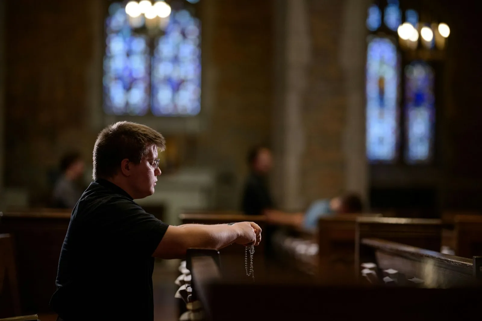 A seminarian spends time in prayer in the chapel of Sacred Heart Major Seminary in Detroit. Withdrawing from the world to focus on prayer and relationship with God and others isn't a new concept, Father Stephen Pullis said, but in a world dominated by technology, building healthy habits will contribute to forming better priests. Credit: Photos by Marek Dziekonski | Special to Detroit Catholic